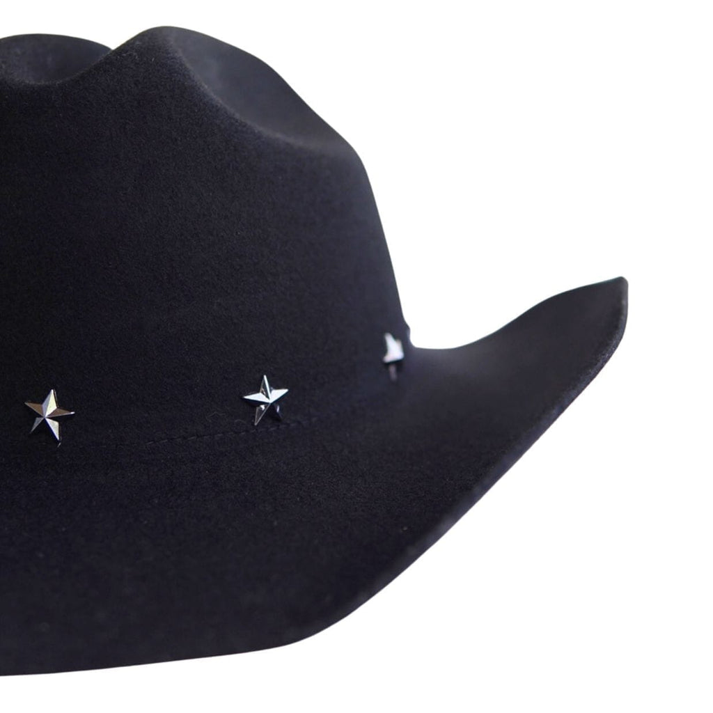A close-up of a black cowboy hat featuring three small silver star-shaped studs on the side, set against a plain white background.