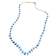 Bright blue round block turquoise beads, showcasing the vibrant color and texture of the Southwestern-style stones.
