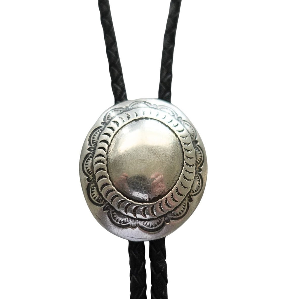 Handcrafted sterling silver concho bolo tie with black leather cord and silver tips