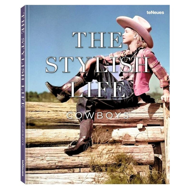 The Stylish Life Cowboys book cover featuring a vintage photograph of a cowgirl sitting on wooden logs under a blue sky.