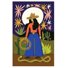 A stylized western art print featuring a woman in a cowboy hat and wide-leg blue pants holding a lasso, set against a desert landscape with cacti, a snake, and a large white moon on a dark purple sky.