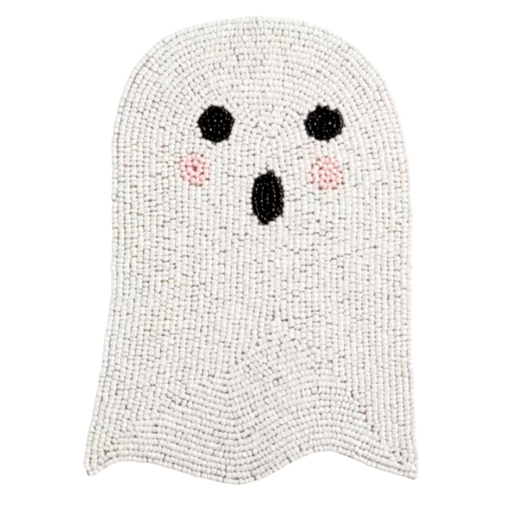 A ghost-shaped trivet made of white and light gray textured beads, featuring a simple black face with pink cheeks on a plain white background.