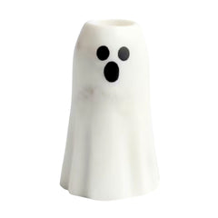 A small white ghost-shaped taper candle holder with a black surprised face, shown on a plain white background.