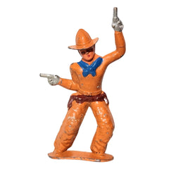 A vintage toy figurine of a cowboy pointing two pistols, painted in  orange and blue on a white background.