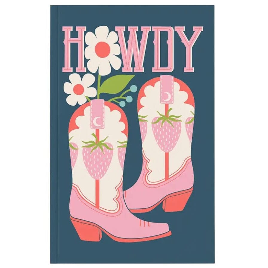 A hardcover notebook or journal with a dark teal cover featuring a western-themed illustration. The design includes the word 'HOWDY' in pink block letters, two pink cowboy boots decorated with strawberry and moon patterns, and two white flowers with pink centers.