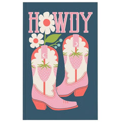 A hardcover notebook or journal with a dark teal cover featuring a western-themed illustration. The design includes the word 'HOWDY' in pink block letters, two pink cowboy boots decorated with strawberry and moon patterns, and two white flowers with pink centers.