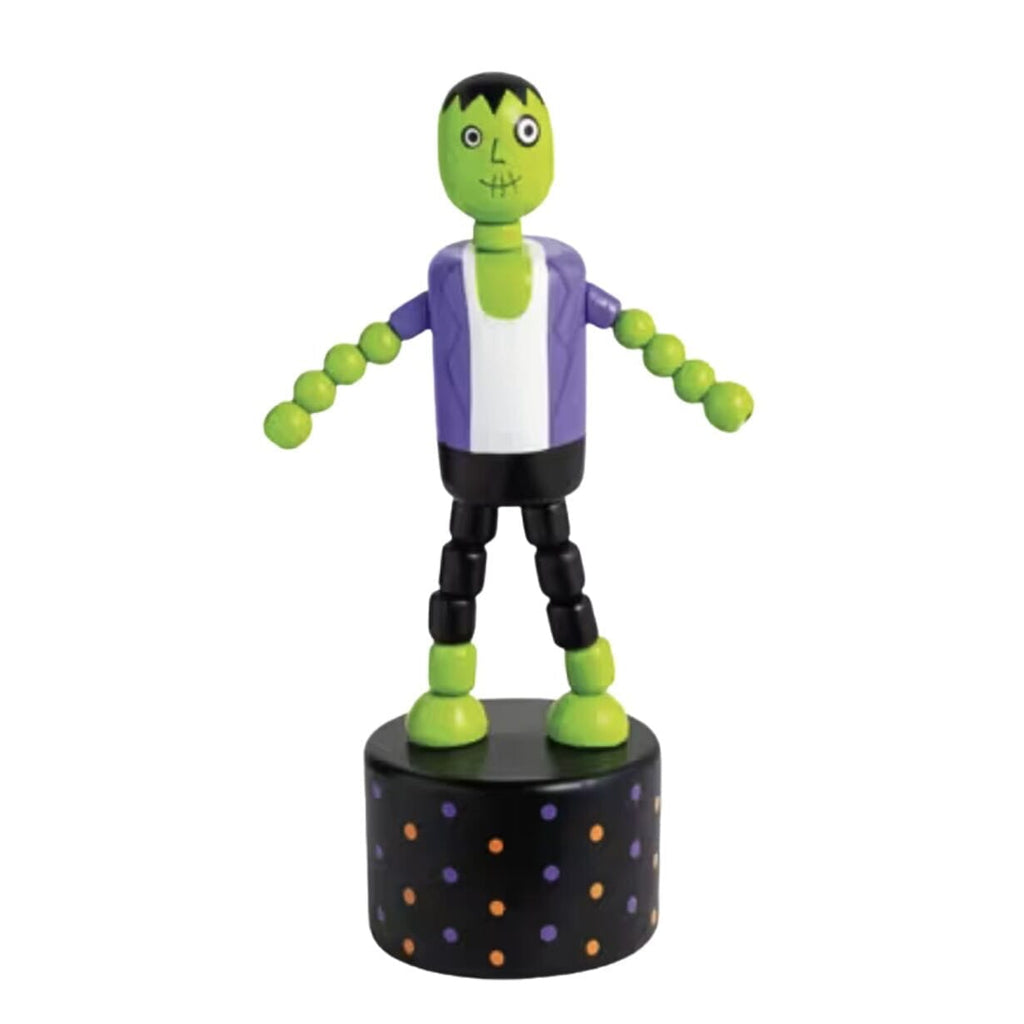 A small Halloween Frankenstein toy figurine standing on an wood base. 