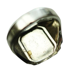 A single metallic ring photographed on a plain white background, shown from an angled top view.
