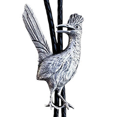 A silver roadrunner bolo tie on a black braided cord against a plain white background.
