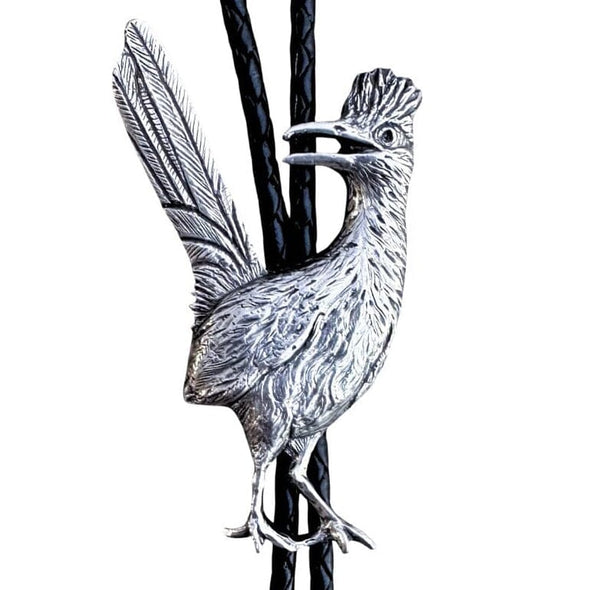 A silver roadrunner bolo tie on a black braided cord against a plain white background.