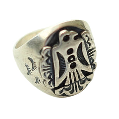 A silver-toned signet ring featuring a highly detailed, raised Thunderbird emblem with dark oxidized recesses, shown on a plain white background.