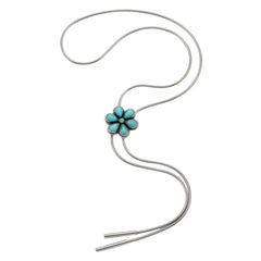 A silver bolo tie necklace featuring a five-petal turquoise flower centerpiece set against a plain white background.