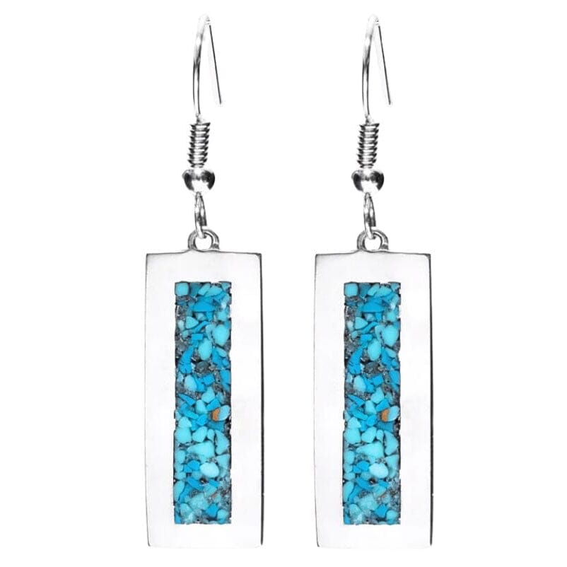 A pair of silver rectangular drop earrings featuring a vertical inlay of vibrant turquoise blue stone chips on a white background.
