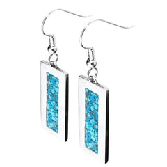 A pair of silver drop earrings with rectangular silver-toned pendants featuring a vibrant turquoise blue inlay, shown against a plain white background.
