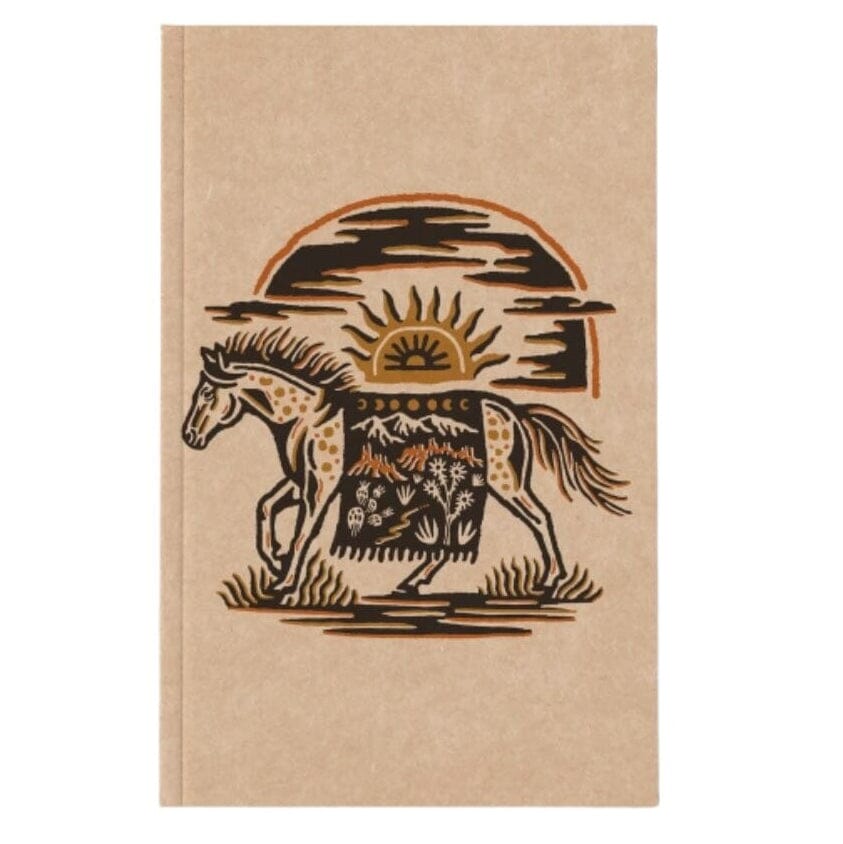A kraft paper notebook with a western-style illustration of a horse carrying a patterned blanket under a sun and mountain arch.