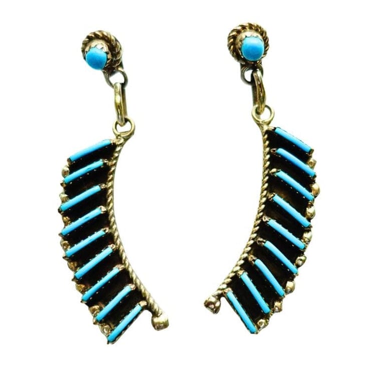 A pair of dangle earrings by Davis Kaamasee with curved rows of turquoise beads and a small round turquoise stone at the top, shown on a plain white background.